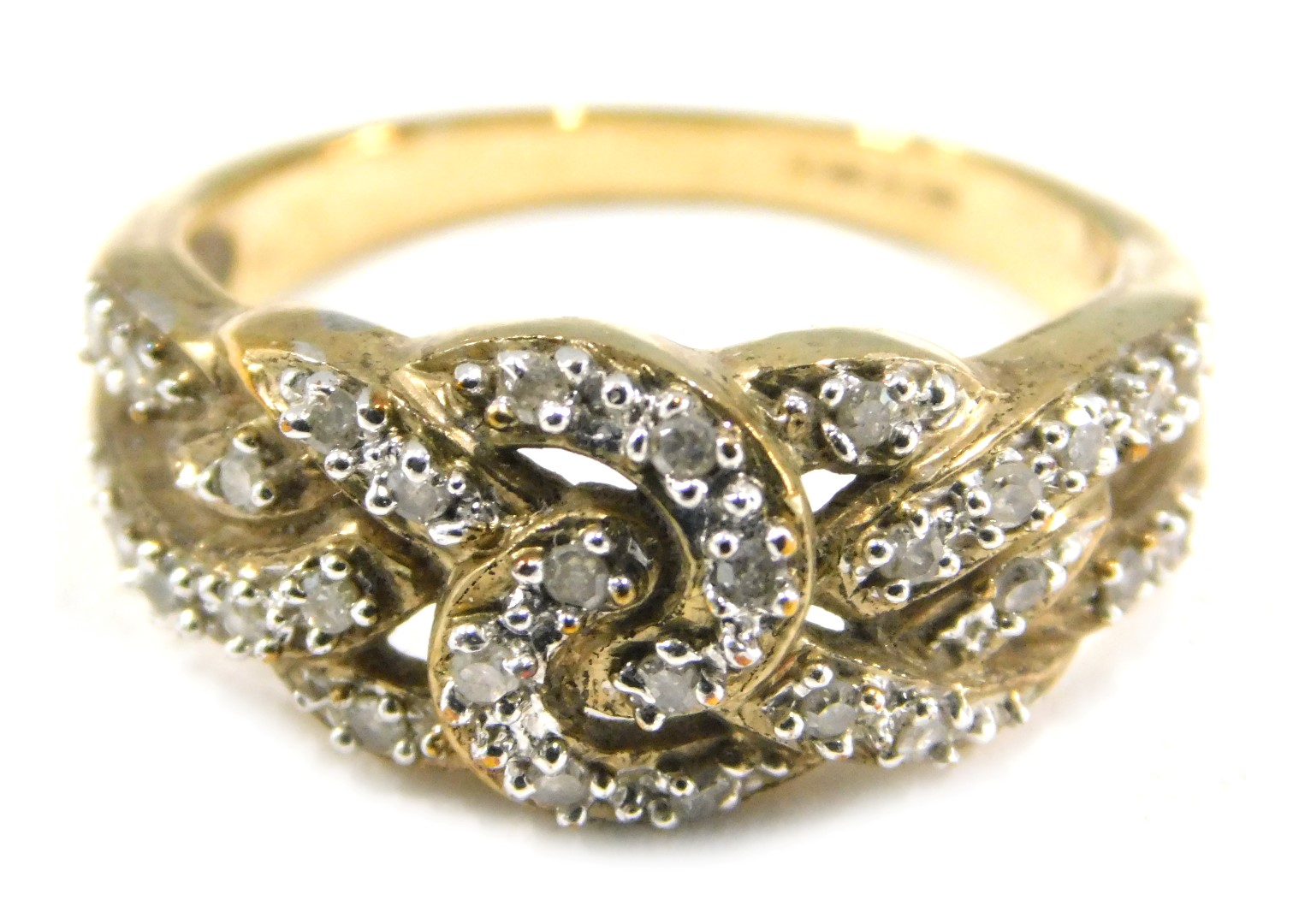 A 9ct gold and CZ set dress ring, of layered cross over design, set with tiny CZs on a yellow metal