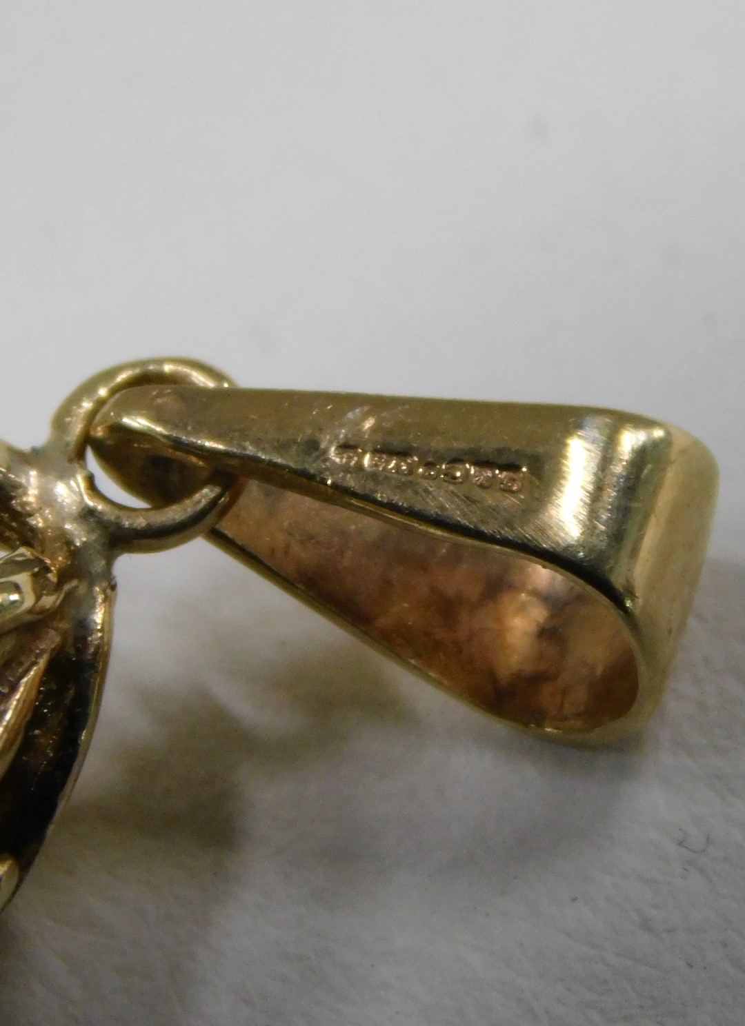 A smokey quartz pendant, the tear drop cut smokey quartz, 4cm high x 2.5cm wide, with a 9ct gold flo - Image 3 of 3