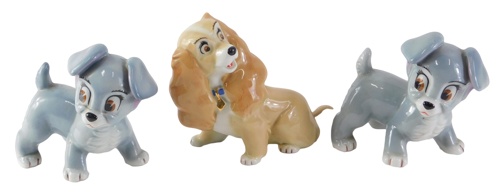 Three Wade Aristocrat dogs, comprising two grey, 10cm high, and another 12cm high.