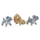 Three Wade Aristocrat dogs, comprising two grey, 10cm high, and another 12cm high.