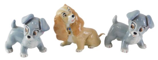 Three Wade Aristocrat dogs, comprising two grey, 10cm high, and another 12cm high.