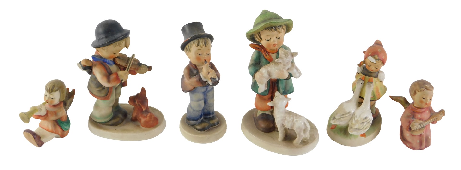 A Hummel figure of a shepherd boy, 14cm high, and other figures.