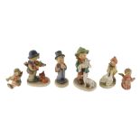 A Hummel figure of a shepherd boy, 14cm high, and other figures.