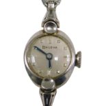 A Bulova stainless steel cased ladies wristwatch, the oval watch head, with a silvered dial and blue