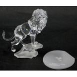 A Swarovski crystal figure group of a roaring lion, on rocked perch, 13cm high, boxed with certifica