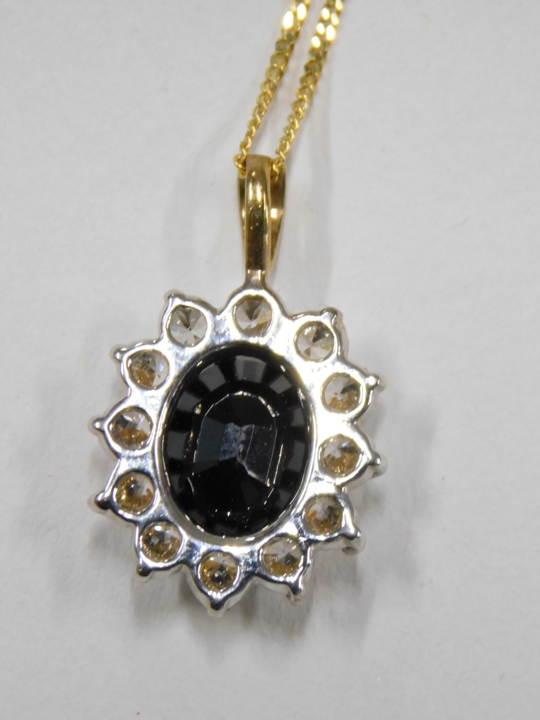 A pendant and chain, the floral cluster pendant set with imitation sapphire and diamond, 2cm high, o - Image 4 of 4