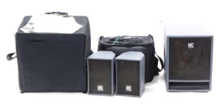 A flight case containing Lucas XT HK Audio speaker and amplifier set. (2)