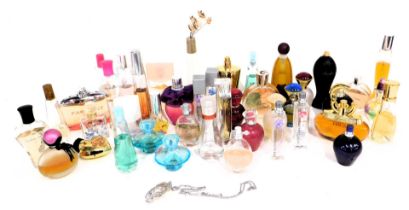 A quantity of empty perfume bottles, to include Sec in the City Nina Ricci, Avon, Skada and others.