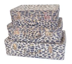 A graduated set of three Antler vintage cases, each printed with faux animal print, the largest 60cm