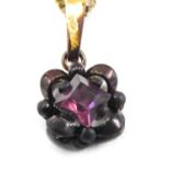 An amethyst pendant and chain, the square cut amethyst in floral loop setting, with gold plated fini