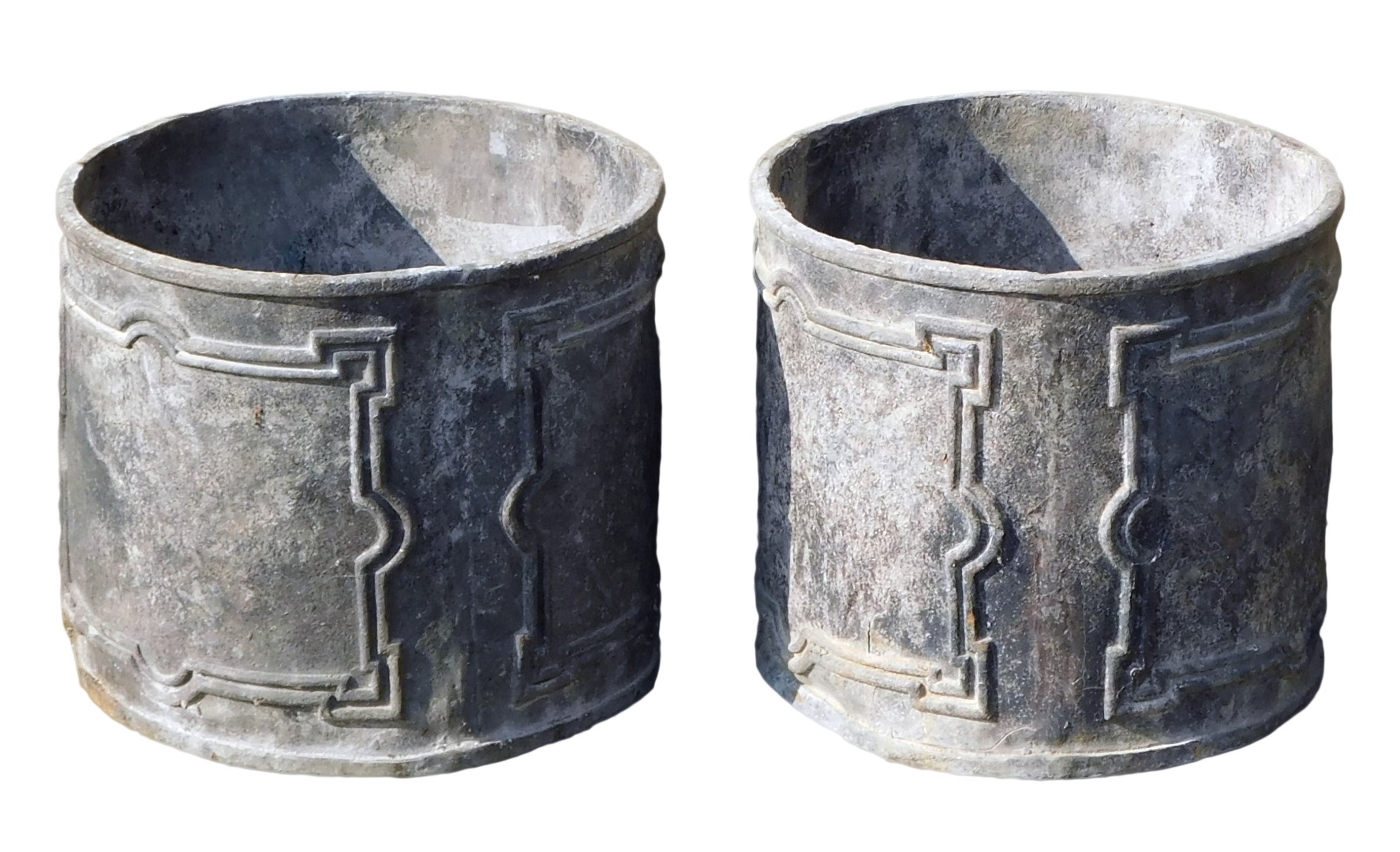 Two lead cylindrical planters, each with a rectangular panel, 29cm high, 35cm diameter. (2)