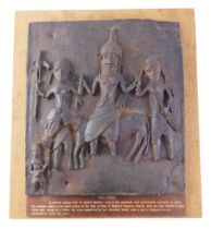 A museum replica model of the Benin plaque, mounted on cork board with informative panel, 49cm high,