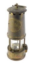 A Protector Type 6 brass miner's lamp, 25cm high.