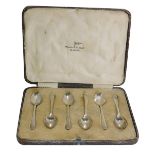 A set of six George V silver Walker & Hall bead topped teaspoons, each with drop fan design, Sheffie