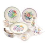 A group of Poole pottery, comprising two large plates, a medium plate, ashtray, mustard and cover, j