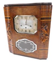 A Veritable Westminster Art Deco clock, in a walnut case, 60cm high, 48cm wide.