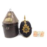 A 19thC Worcestershire regimental helmet, with crest and gilt metal spike, in original tin box, engr