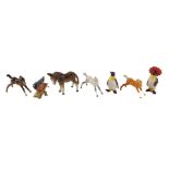 Beswick ornaments, comprising a Beswick donkey, three foals, and a finch, the largest 9cm high, and