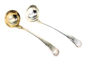 A pair of Victorian silver shell pattern toddy ladles, each bearing the initial J, maker JMD, Edinbu