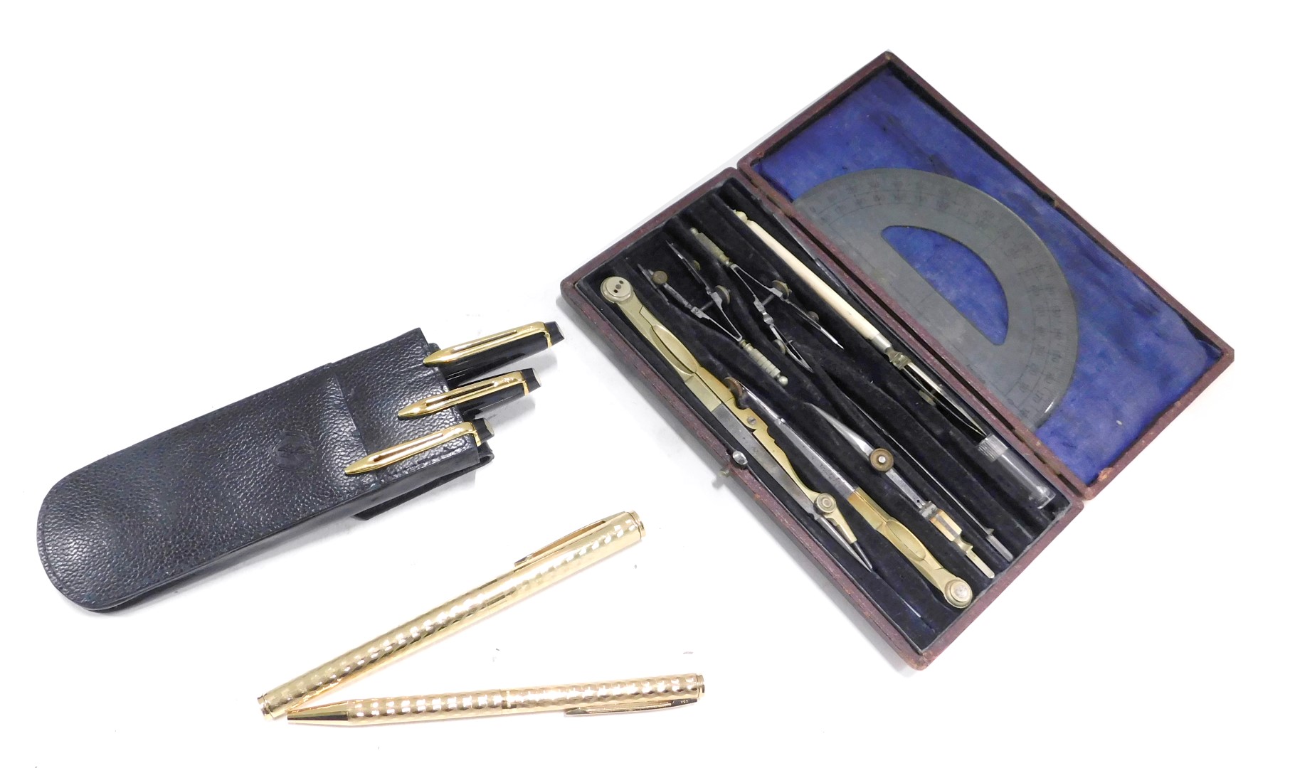 A cased set of three graduated Waterman pens, a Parker fountain and biro set, in gold coloured etche