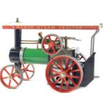 A Mamod model traction engine, painted in typical green, black and red livery, 26cm wide.