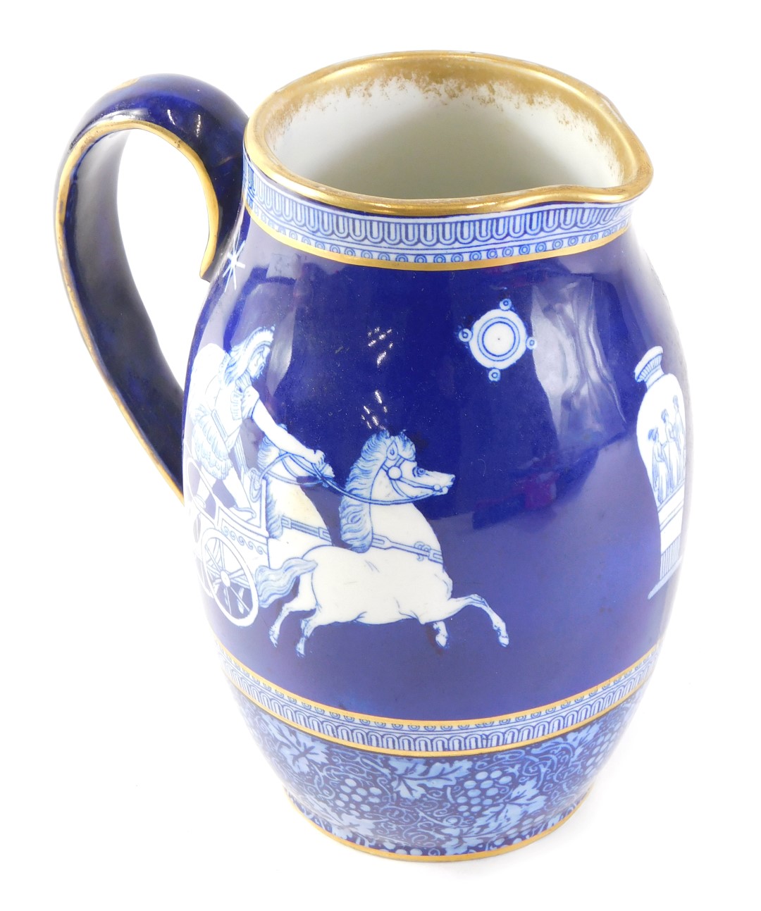 A Royal Doulton water jug, with a royal blue ground and gilded border, depicting Grecian warriors on