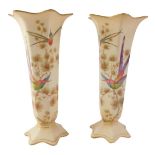 A pair of Crown Ducal stem vases, each with a petalated top and a painted decoration of flowers and