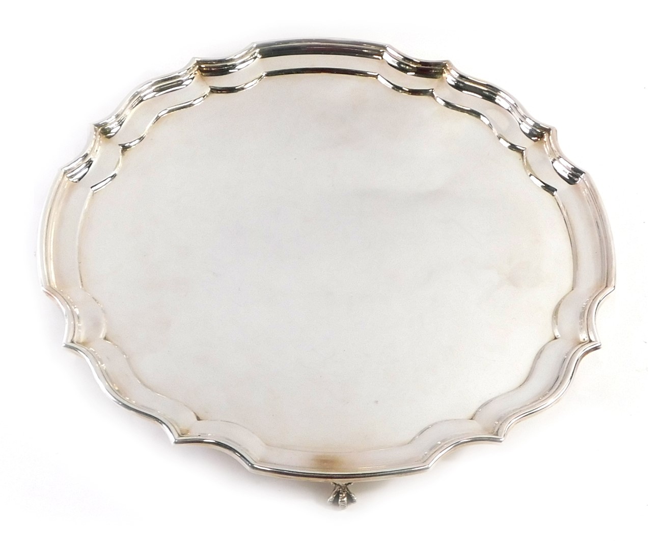 A 20thC silver plated salver, with piecrust border, on four ball and claw feet, stamped EPNS, 35cm d