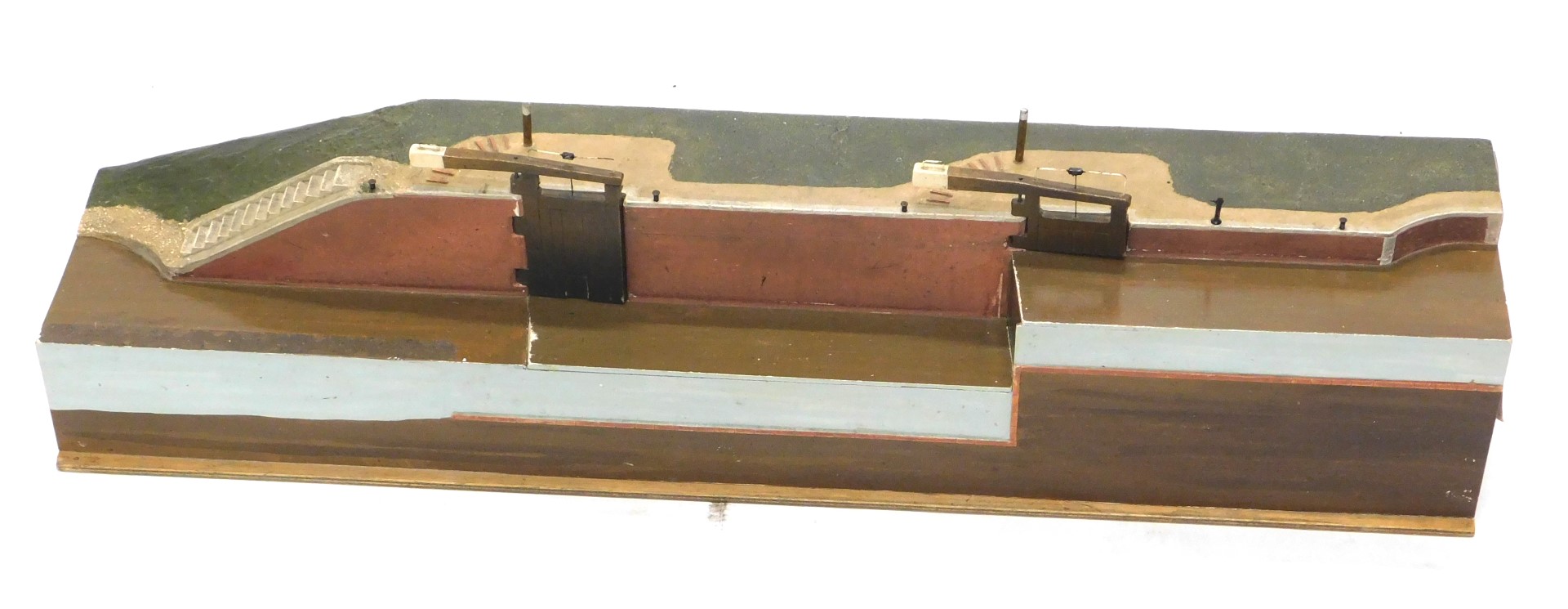 A museum model of a 19thC canal lock, 21cm high, 91cm wide, 18cm deep, in painted blue diamond trave