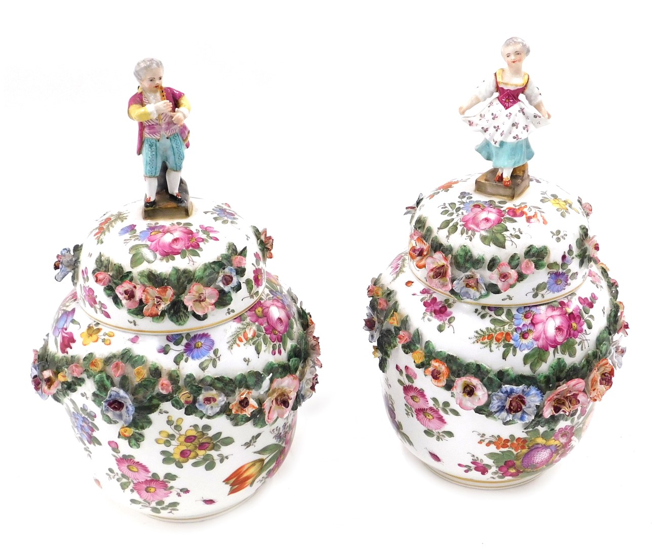 A pair of Dresden porcelain vases and covers, each painted with flowers and with flower encrusted ba