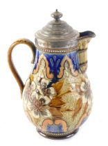 A 19thC Royal Doulton lidded jug, the top mounted with silver plated mounts, on a floral glazed body