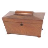 A Victorian mahogany sarcophagus shaped tea caddy, the hinged lid enclosing a part fitted interior,