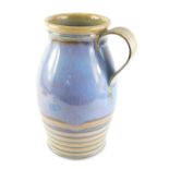 A large Denby purple and pale blue glazed jug or ewer, printed marks to underside, 36cm high.