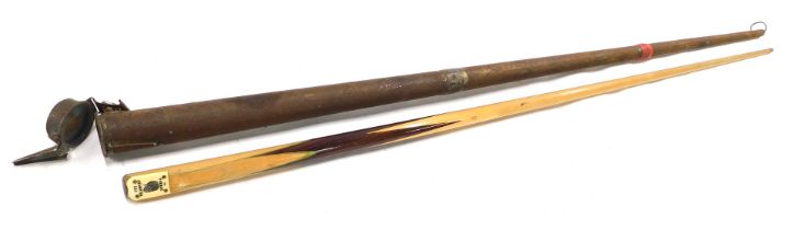 A Permac Champion billiard cue, in ebonised tin case, 148cm long.