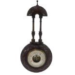 A late 19th/early 20thC carved mahogany aneroid barometer, 48cm high.