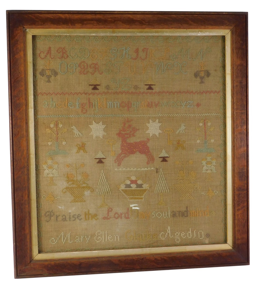 A 19thC sampler by Mary Ellen Clark aged 10, embroidered with stag, alphabet, etc., in oak frame, 53