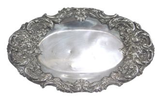 A Victorian silver pin dish, of oval form with embossed floral and scroll border, maker D&F, Birming
