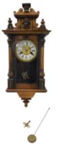 A Vienna wall clock, in walnut case, the dial stamped with cross arrows, 52cm high.