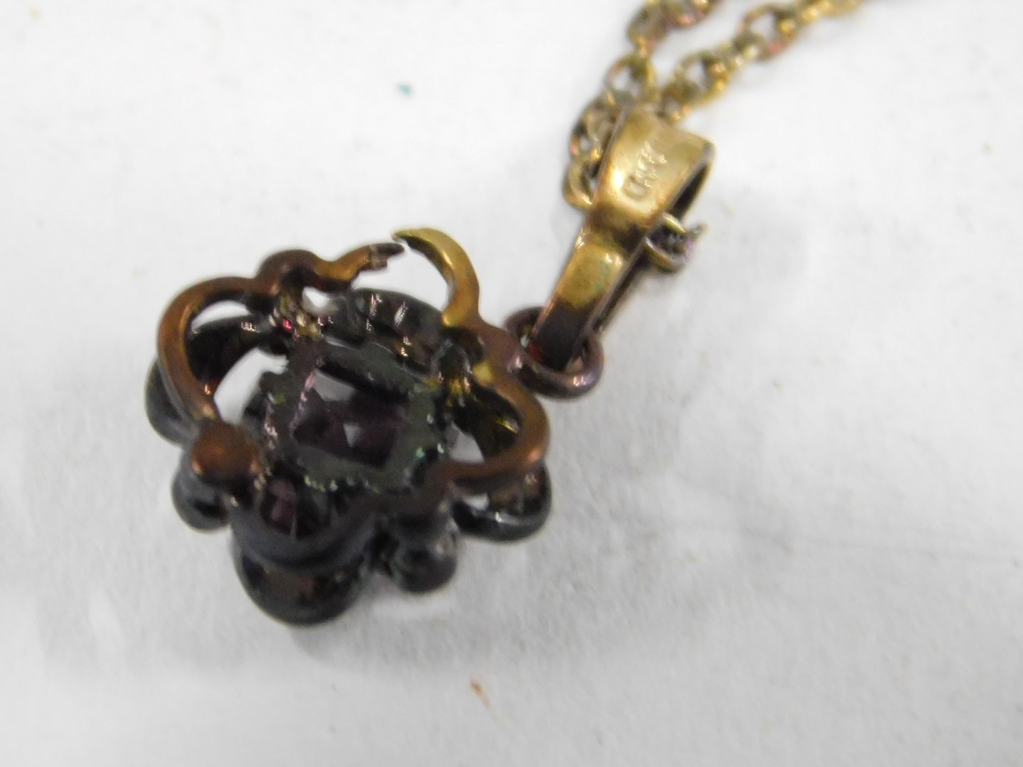 An amethyst pendant and chain, the square cut amethyst in floral loop setting, with gold plated fini - Image 4 of 4