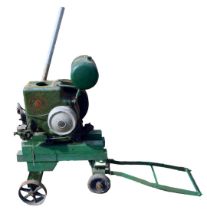 A Ruston Hornsby stationary engine on wooden trolley base, green painted, number 203642, 92cm high,