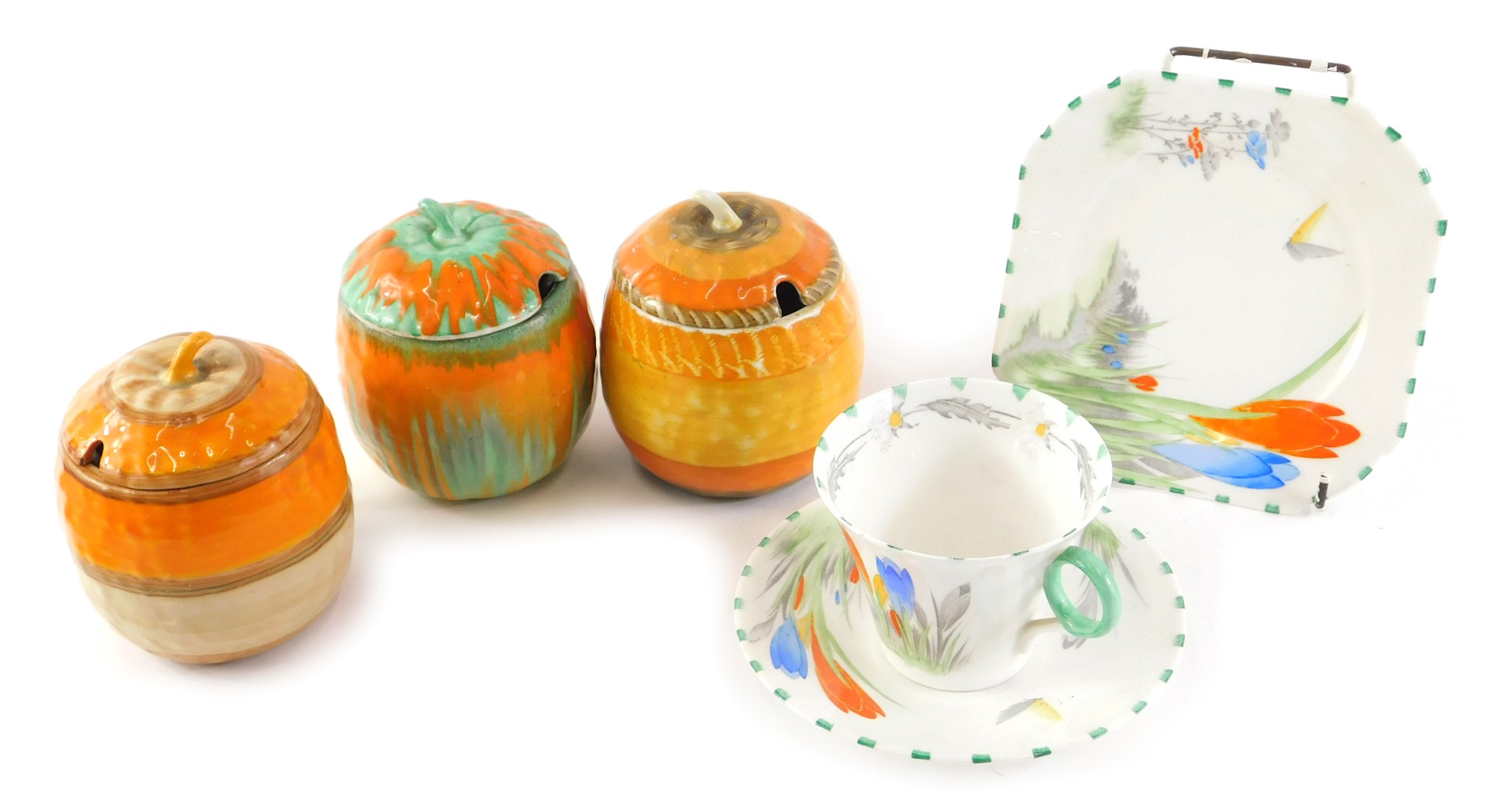 Three Shelley apple shaped preserve jars, each decorated in Art Deco style, and a Shelley trio.