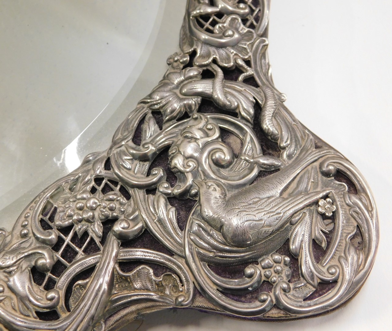 A late Victorian silver dressing table mirror, the bevelled love heart shaped mirror panel surrounde - Image 2 of 4