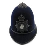 A Nottinghamshire police helmet, with crown for King George V.