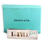 A Roman numeral money clip, stamped Atlas 2004 Tiffany and Co 925, 0.60oz, in Tiffany and Co turquoi