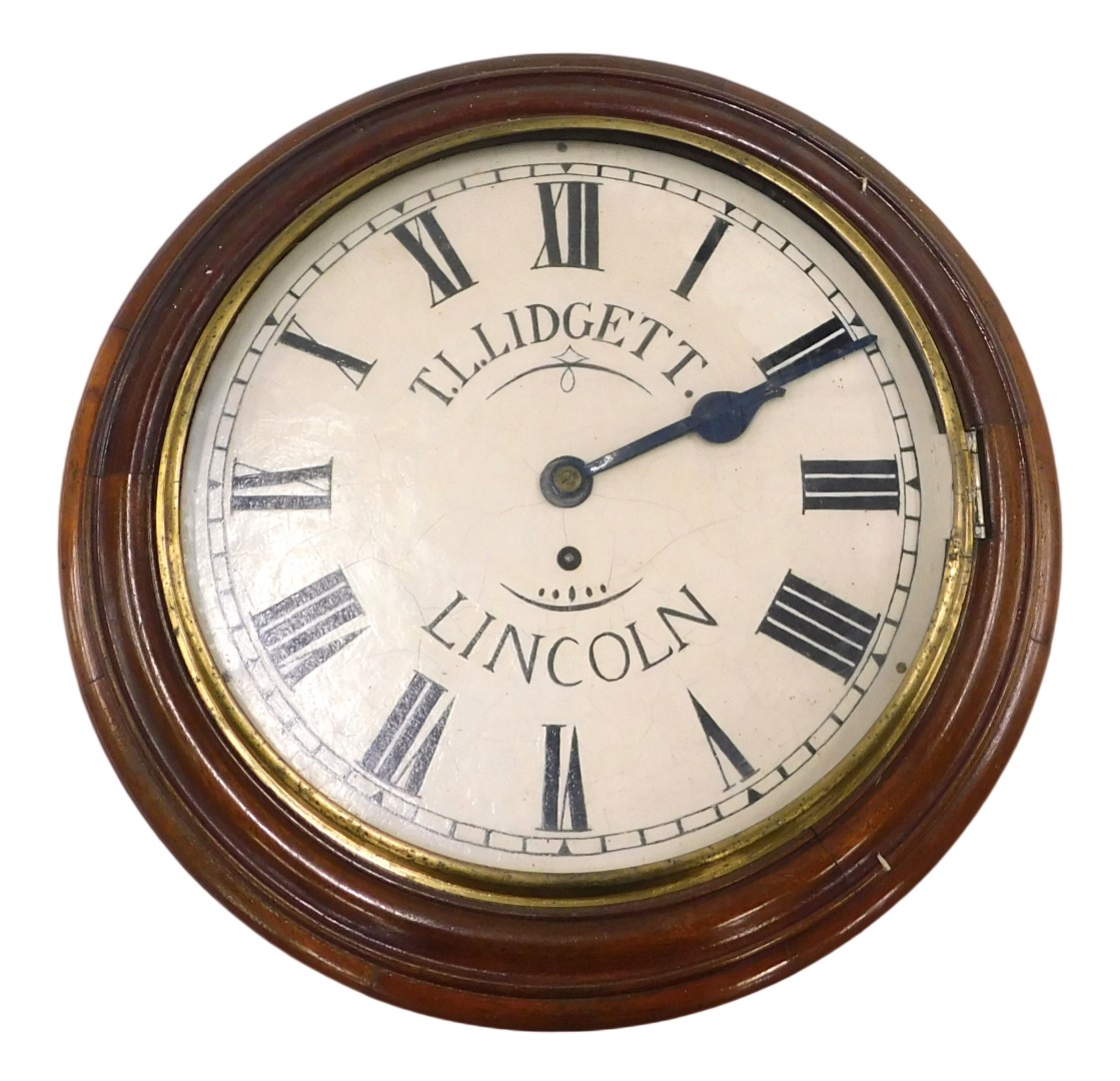 A Victorian mahogany wall clock, the painted dial bearing name TL Lidgett Lincoln, with brass bezel