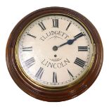 A Victorian mahogany wall clock, the painted dial bearing name TL Lidgett Lincoln, with brass bezel