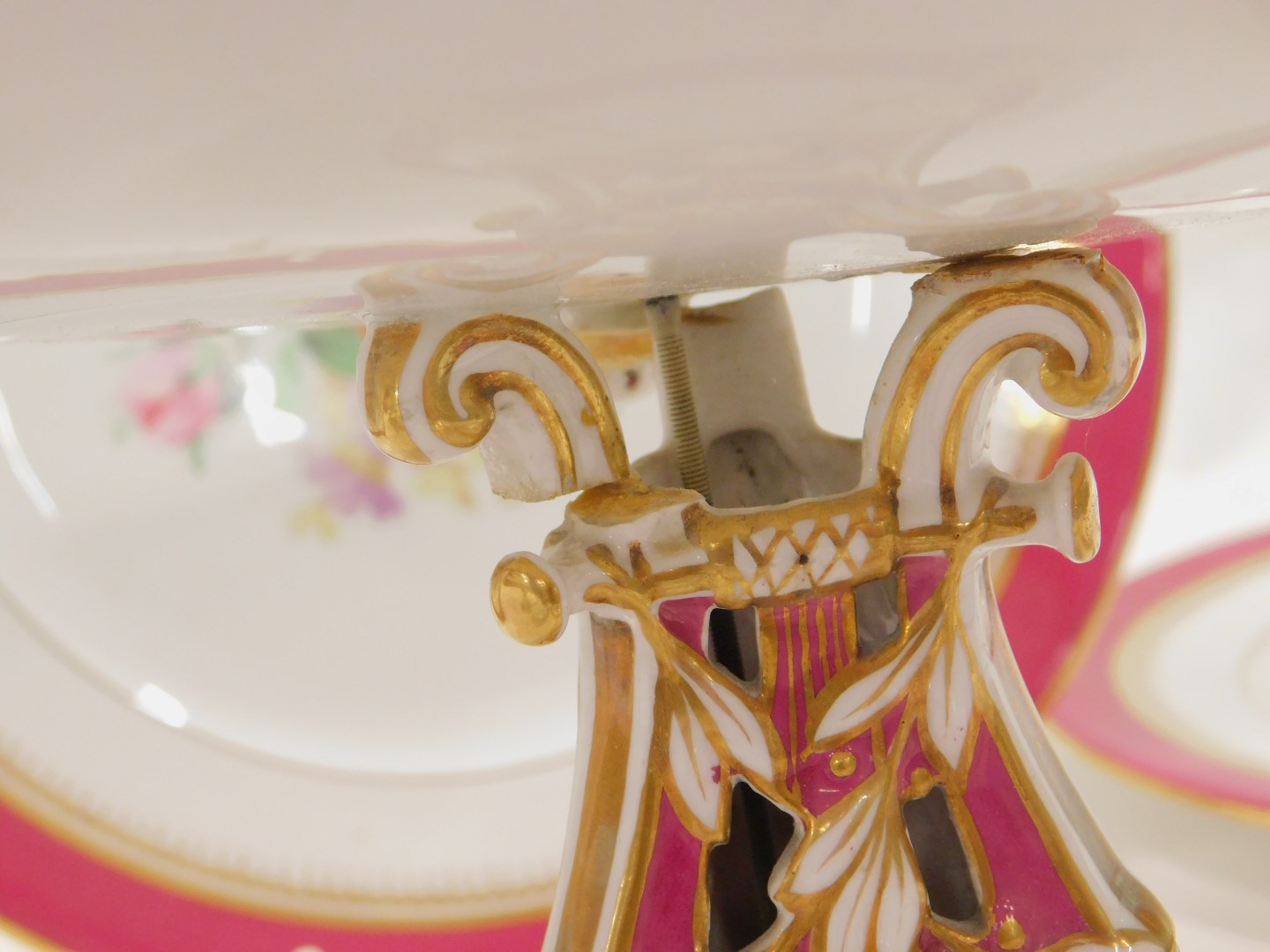 A 19thC dinner service, on a pink border with gilding comprising two cake plates, and four dinner pl - Image 2 of 3