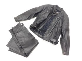 A black leather motorcycle jacket, size 42, and a pair of black leather trousers, size 34.