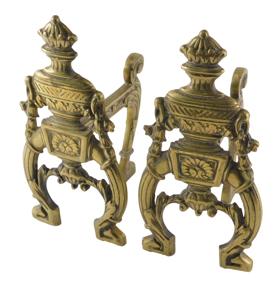 A pair of late 19th/early 20thC Adam Revival brass fire dogs or andirons, each cast with urns and fl