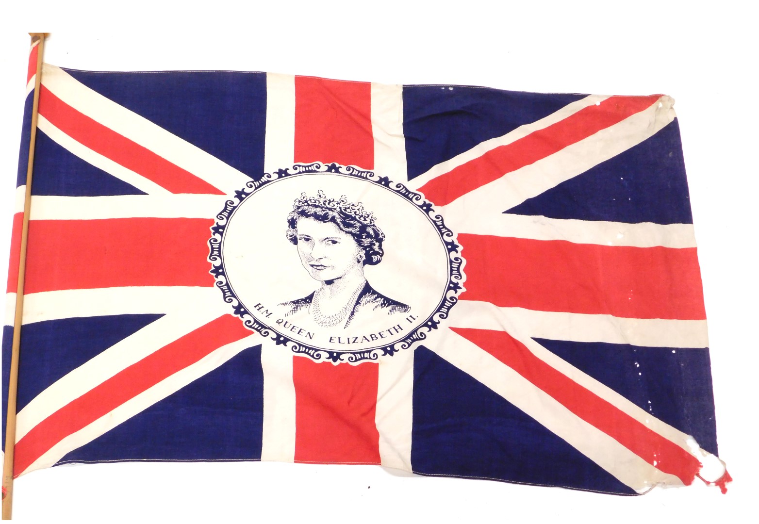 An Elizabeth II Union Jack material flag, the flag 74cm x 52cm, on pine pole 144cm long.